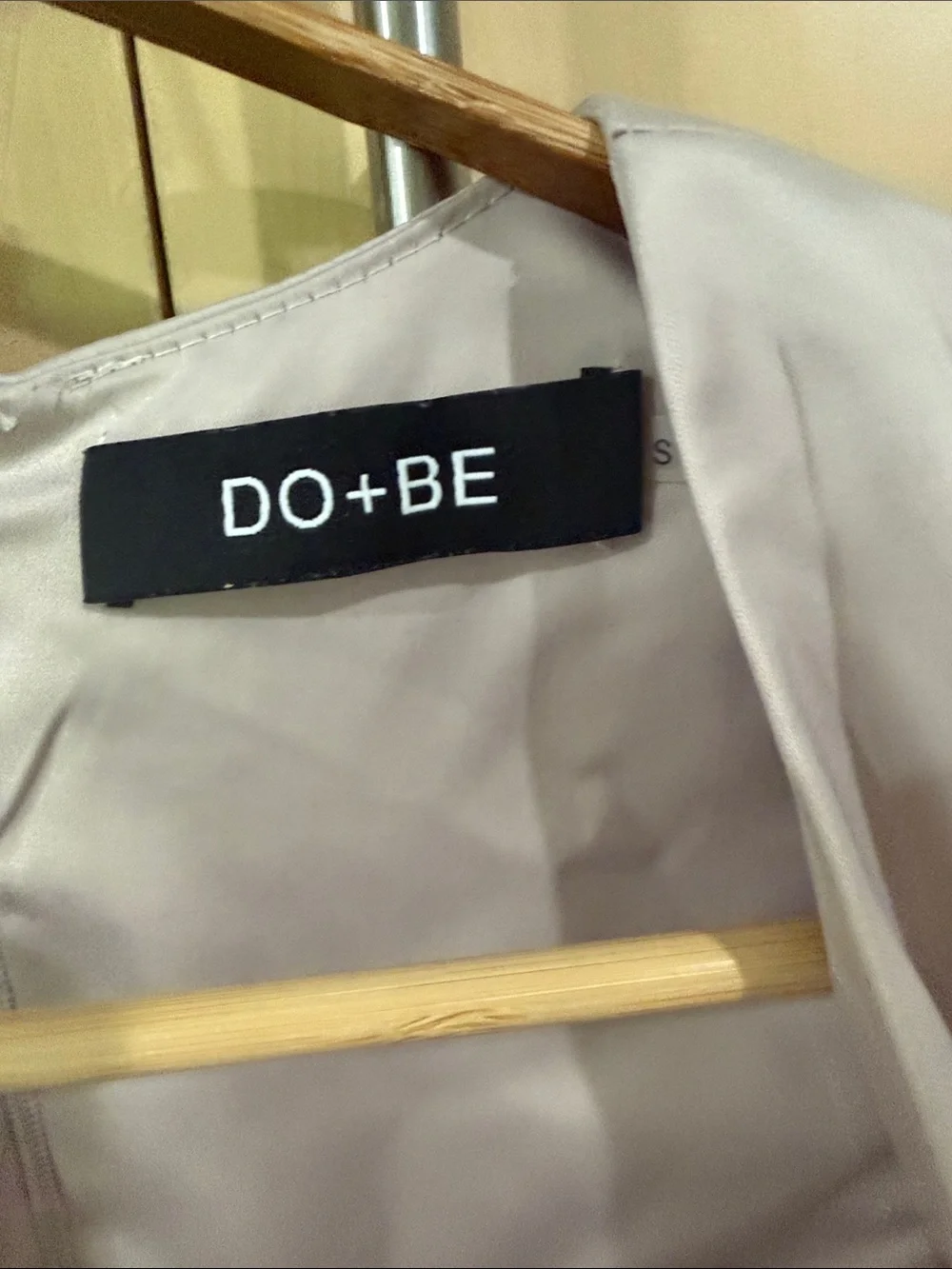 DO+BE Sleeveless elegant Draped Satin V-Neck Romper in golden cream.
